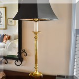 D03. Pair of brass candlestick lamps with feet. 33”h 